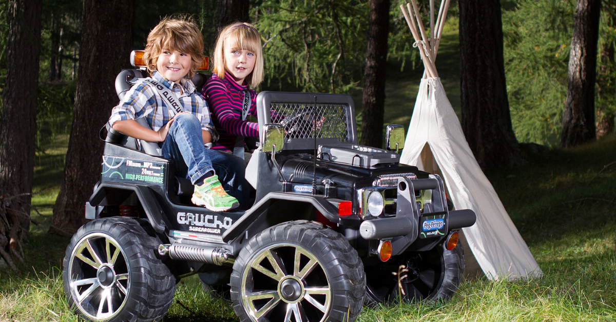 Peg Perego ride on car with two kids camping