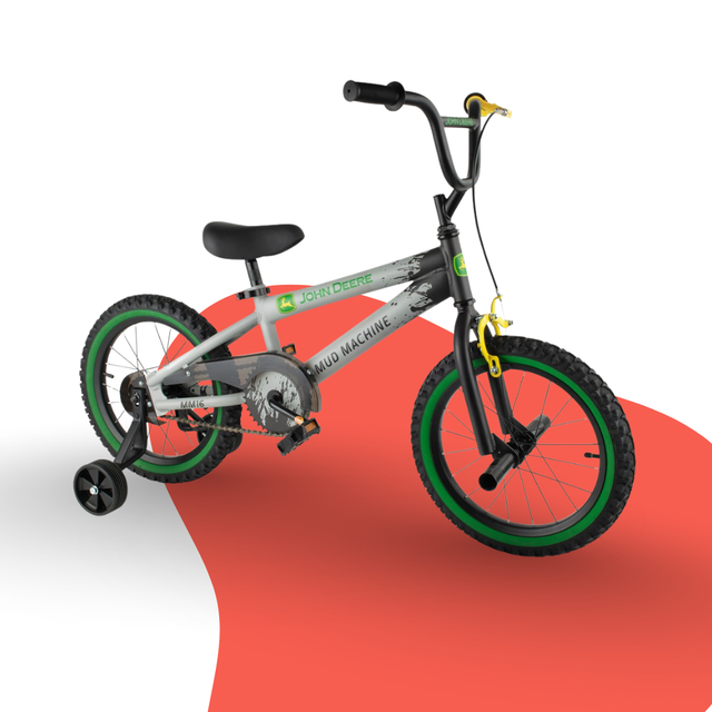 Children's bicycle with training wheels on a white and red background