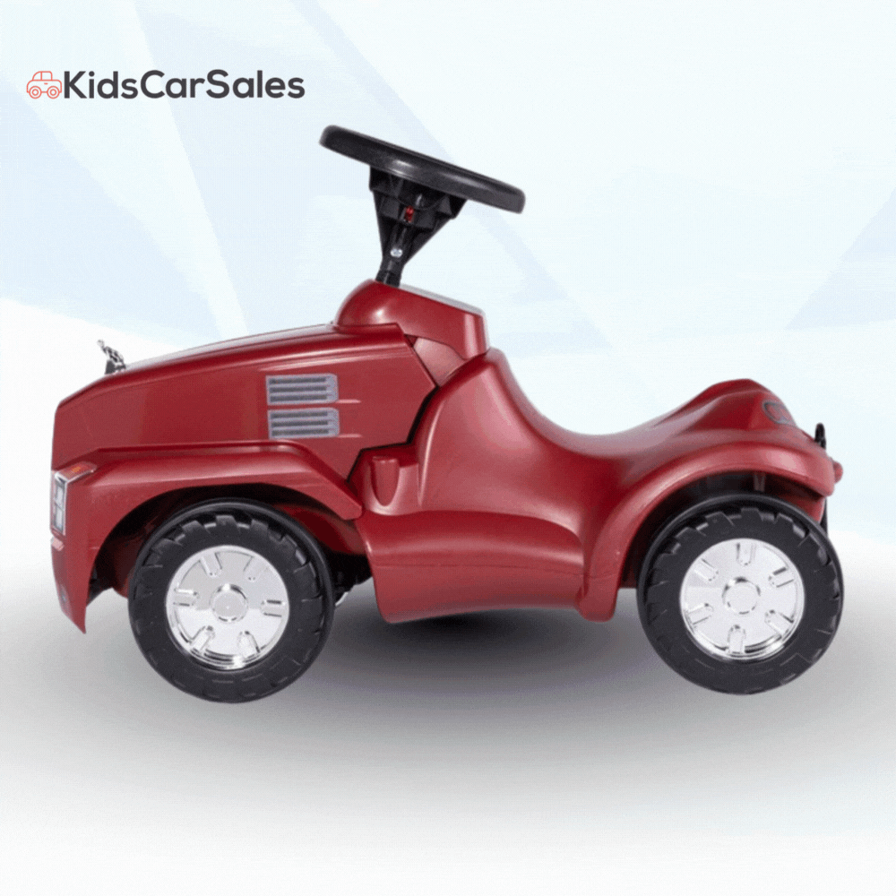 A bright metallic red Rolly Minitruck Mack Kids Ride On Car with large black wheels and silver hubcaps