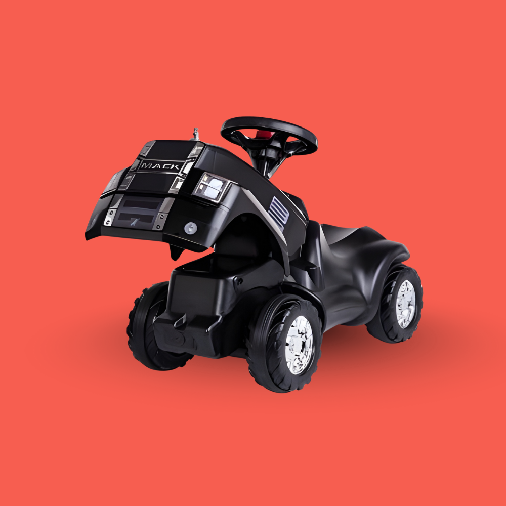 Black toy truck with 'Mack' branding on a red background