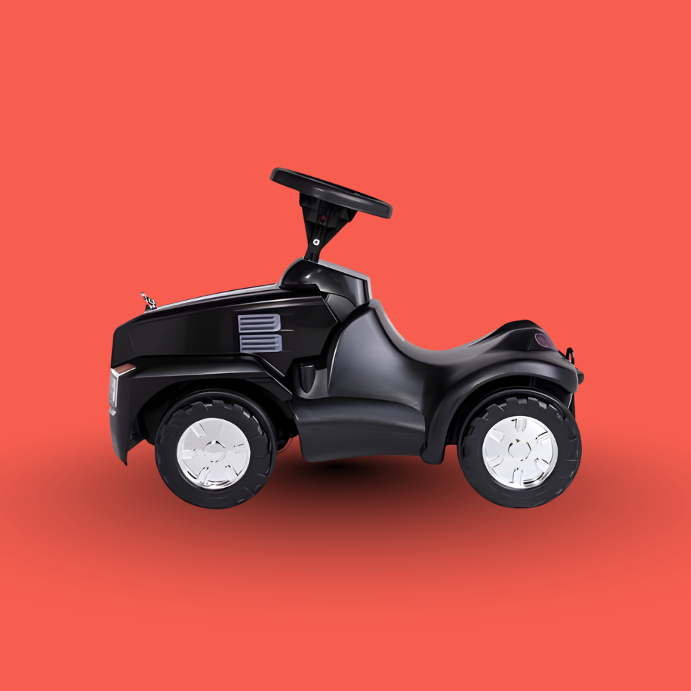 Black toy vehicle with white wheels on a red background