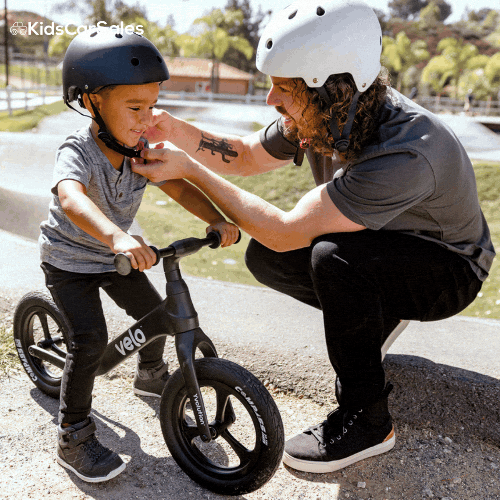 Toddlers in safety gear ride and pose with red, black, and blue Yvolution balance bikes.