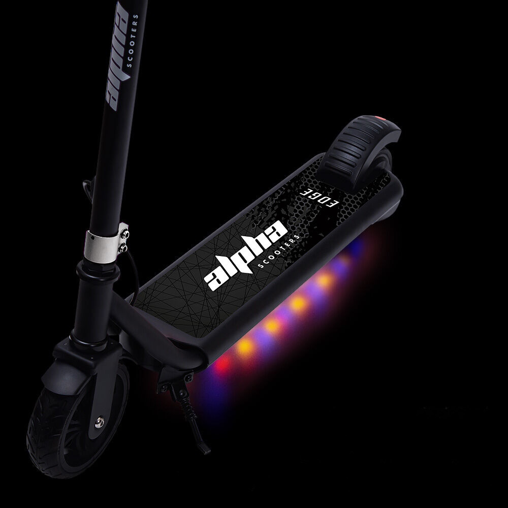 Black scooter with LED lights on a black background
