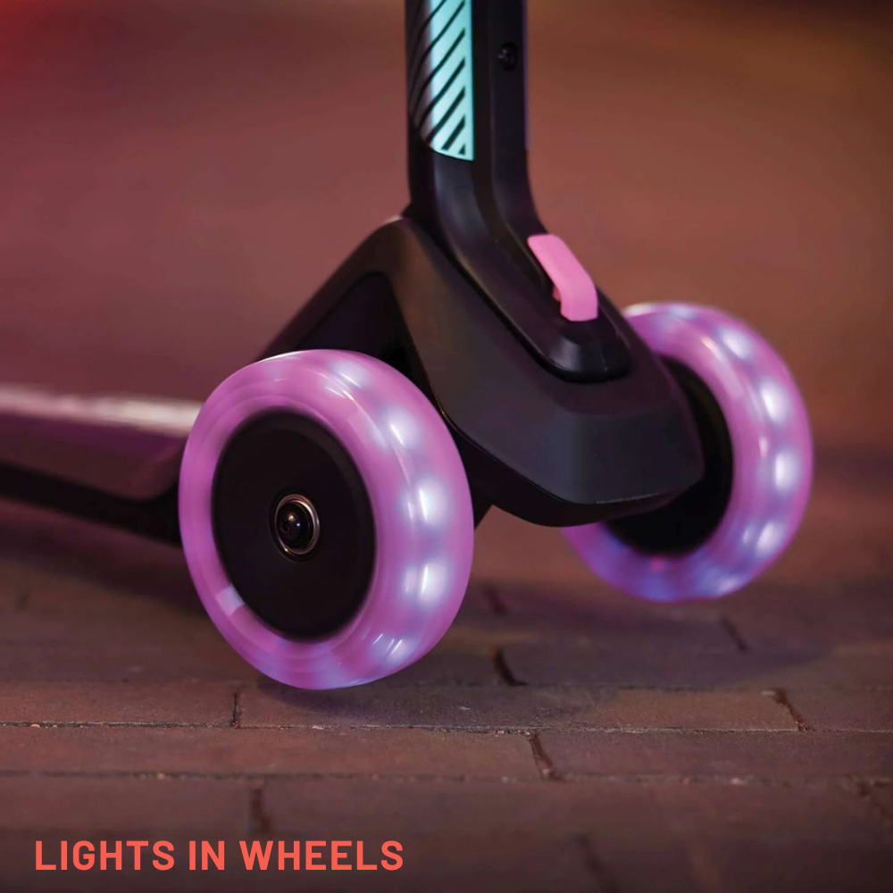 Close-up of a scooter with pink wheels on a brick surface