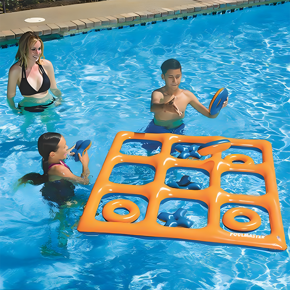 Two children playing with an inflatable Tic-Tac-Toe game in a pool. The floating orange grid has some pieces scattered around, with one child about to toss an 'O' piece