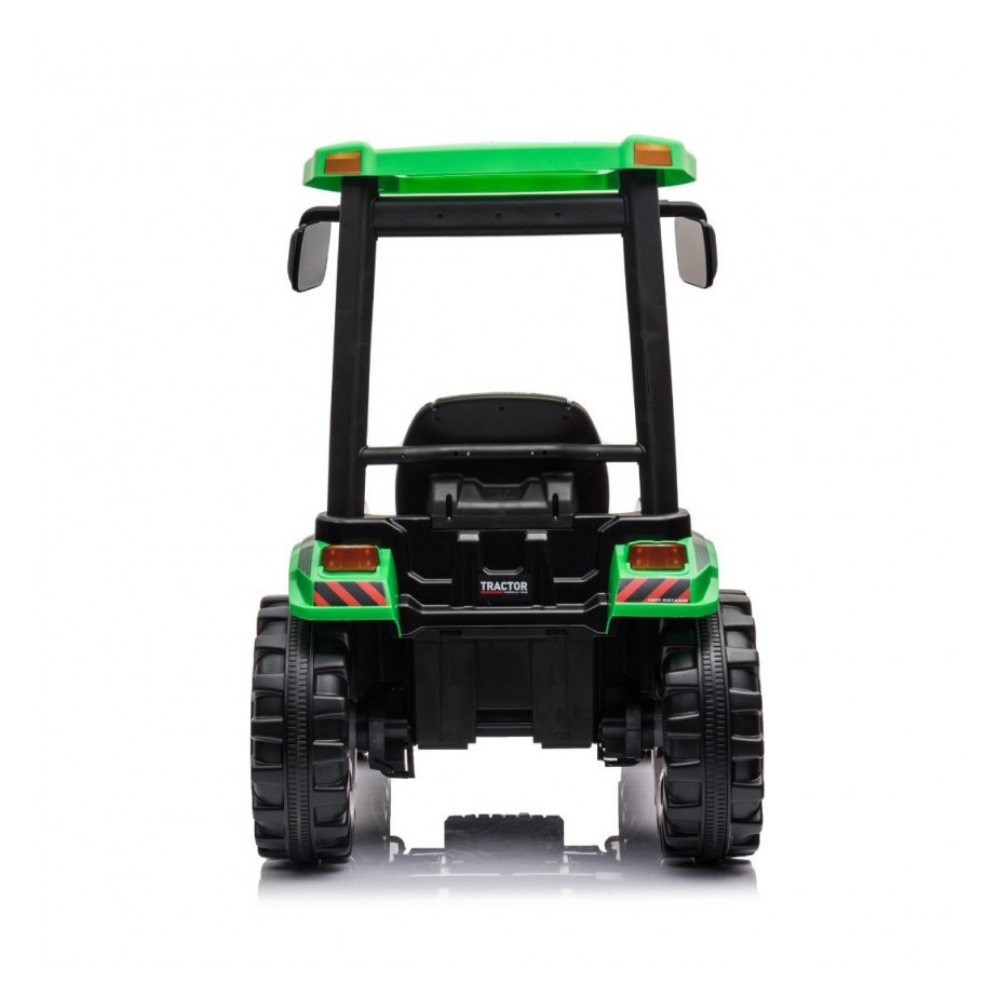 A black and green ride-on toy tractor viewed from the rear, featuring large black wheels, a black seat, and green trim with orange reflective accents on a white background.