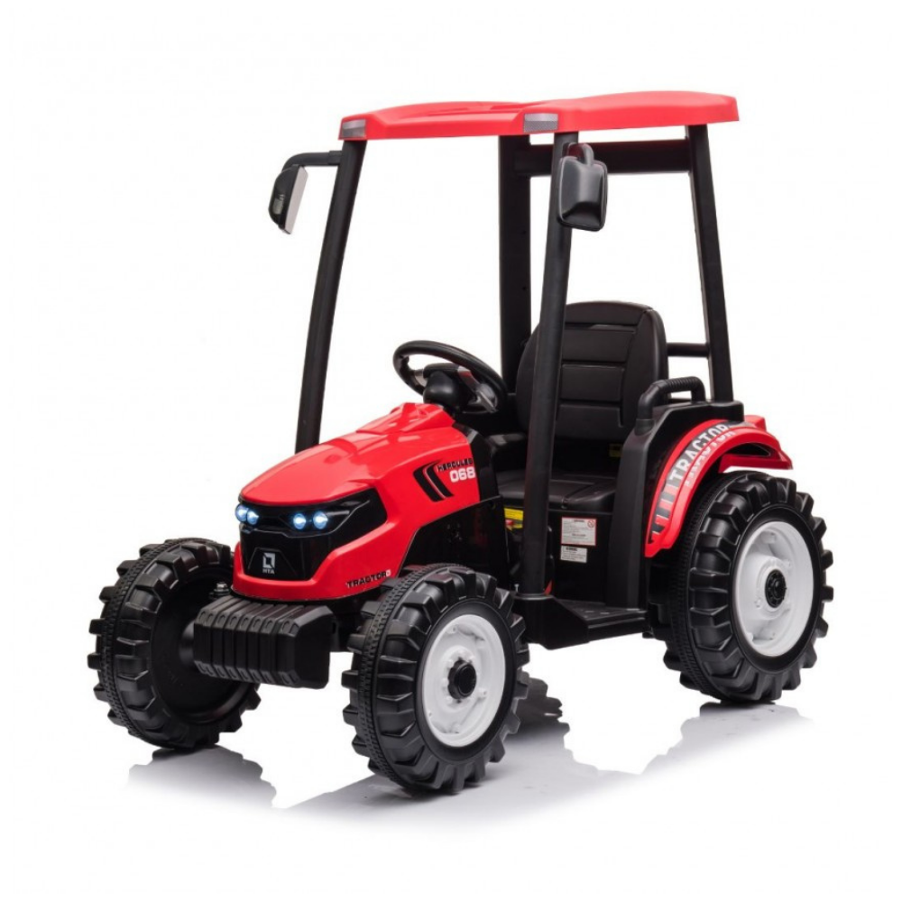 A red and black ride-on toy tractor with a canopy roof, steering wheel, and large black wheels, photographed on a clean white background.