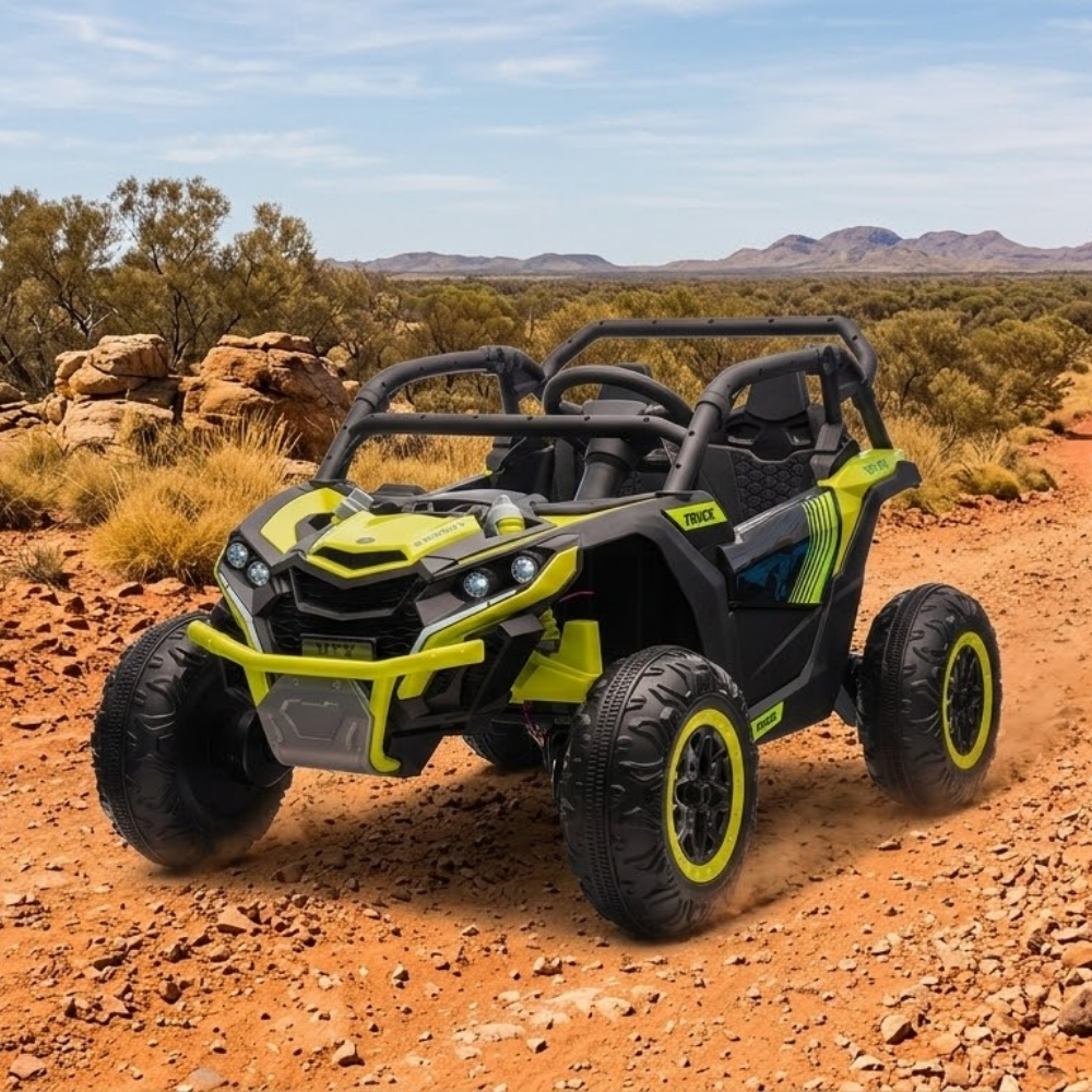 Yellow and black off-road vehicle on a dirt road with desert landscape in the background