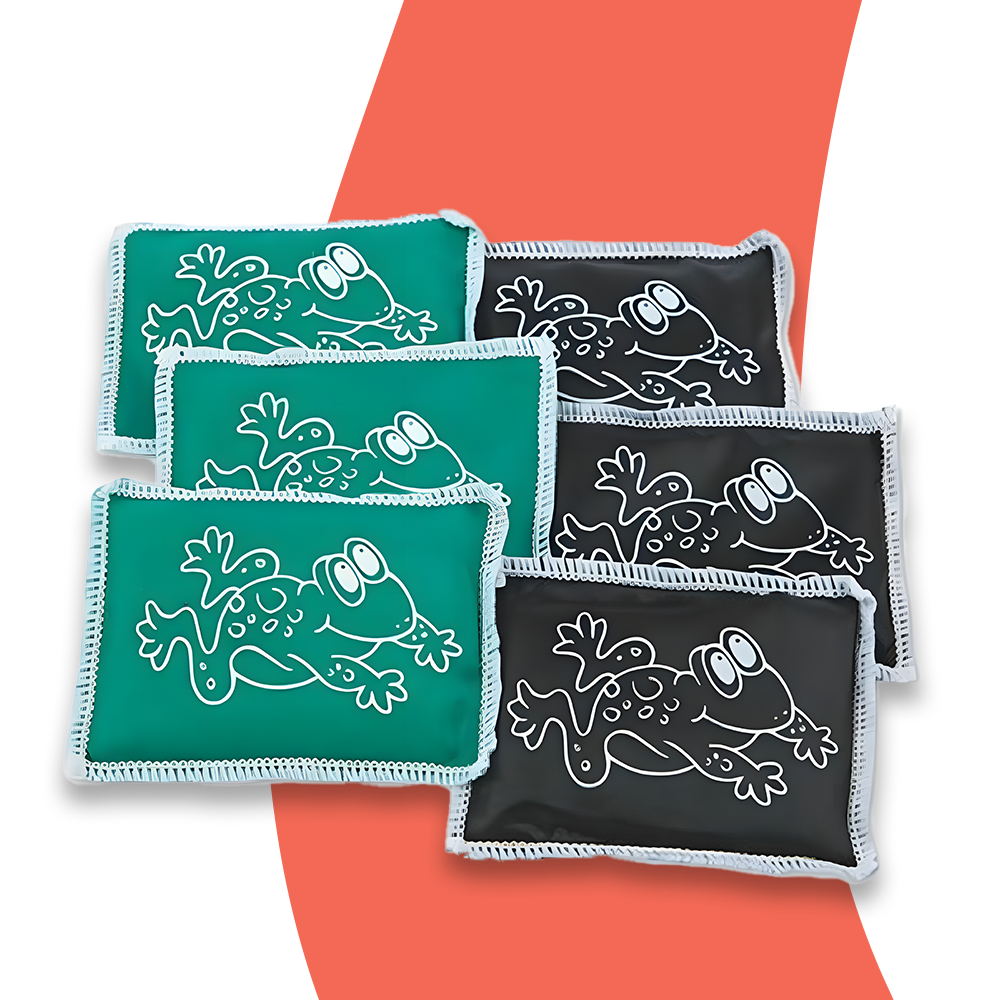 A set of six frog-themed beanbags, three green and three black, with white frog illustrations on them. The beanbags are displayed against a white and red background