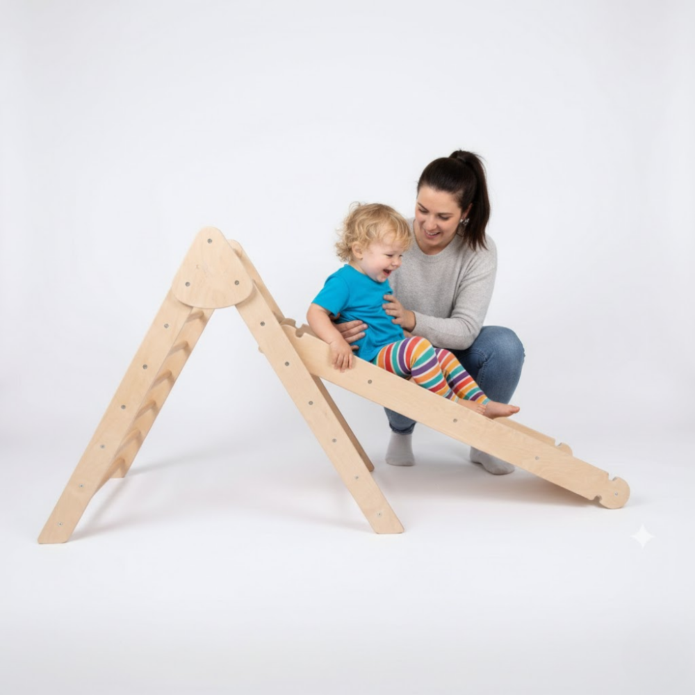 Child playing on a wooden climbing toy with a woman on a white background