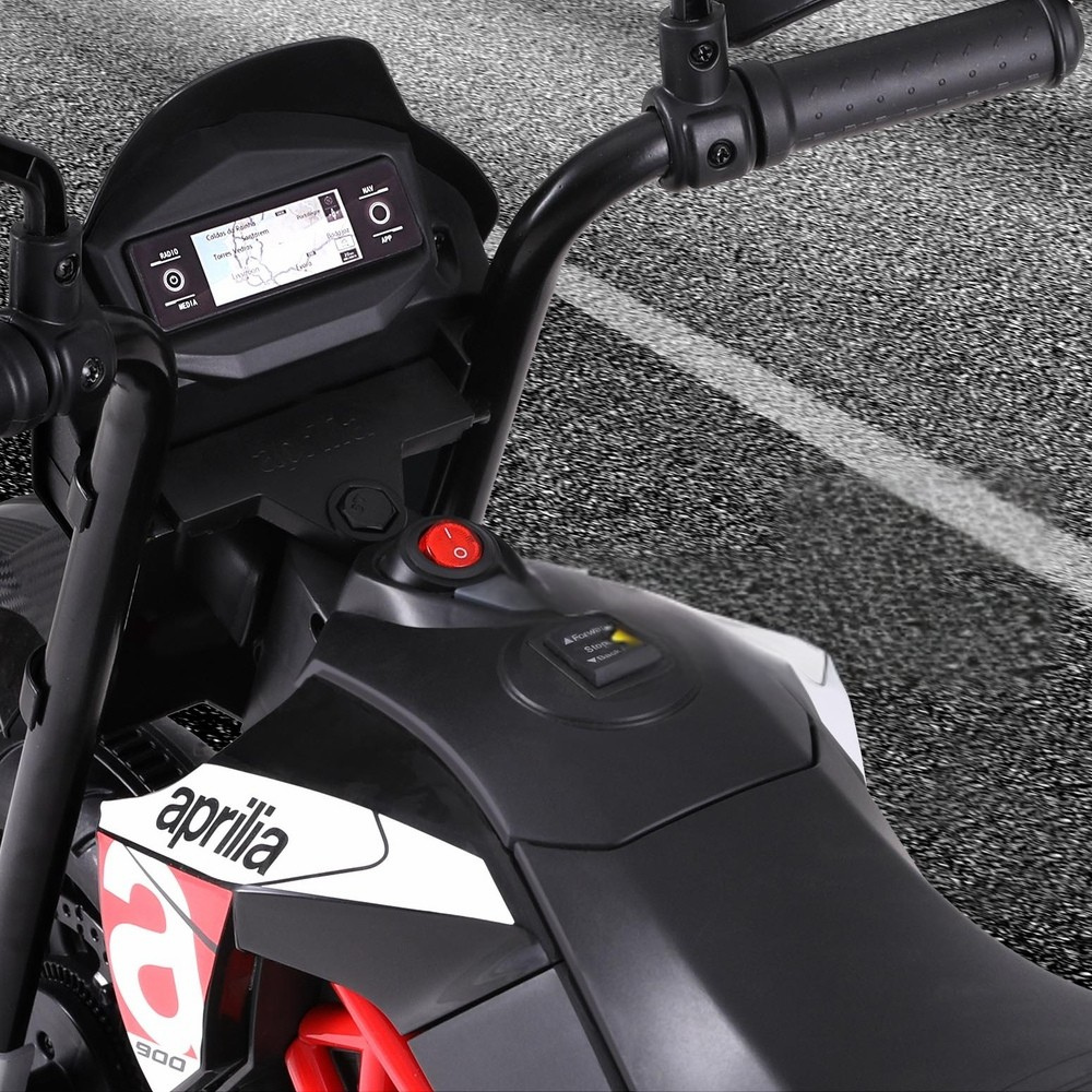 Close-up of a motorcycle handlebar with digital display and Aprilia branding.