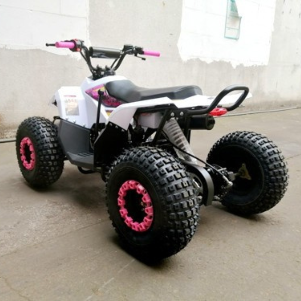 White ATV with black tires and pink rims on a concrete surface.