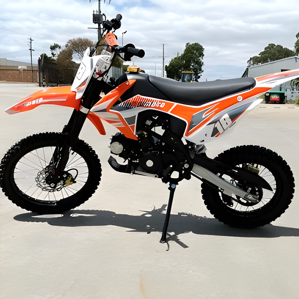 side view of MJM 125cc Petrol Powered 4-Stroke E-Start Kids Dirt Bike - Orange