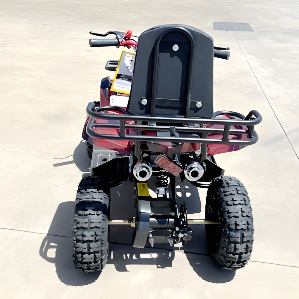 Back view of a small ATV on a concrete surface