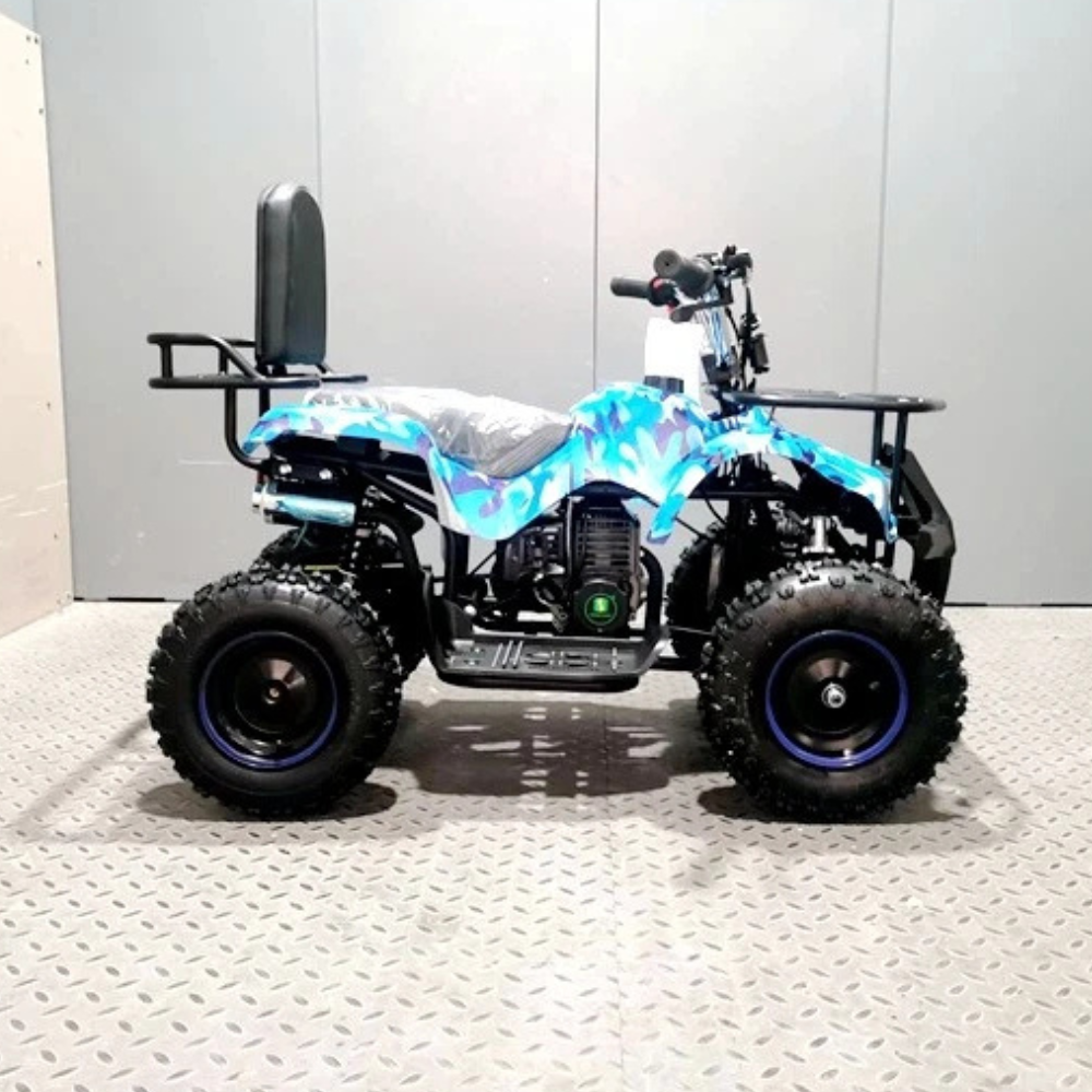 Quad bike with blue and white camouflage design on a gray floor.