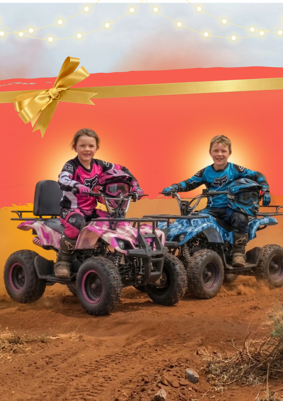Two children wearing motocross gear smile while riding pink and blue ATVs on a dirt track, with a festive red and orange background featuring a gold ribbon and bow graphic.