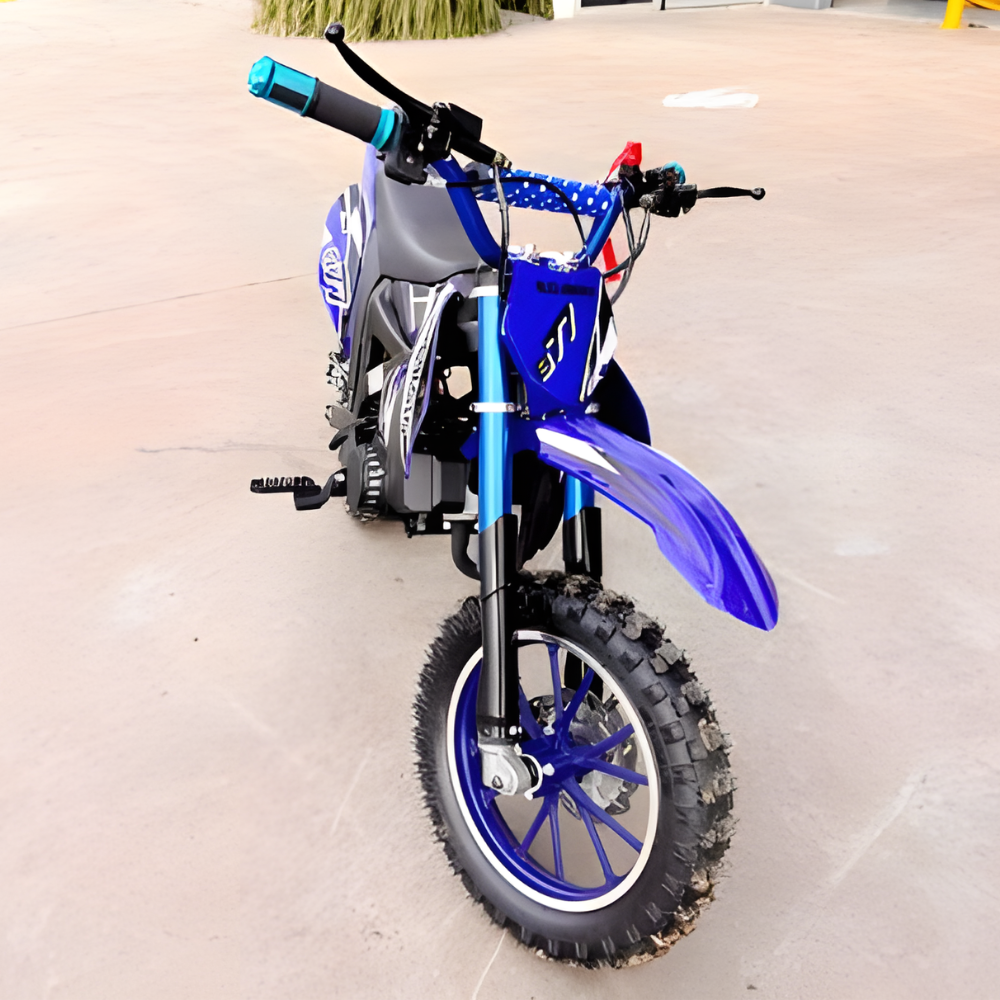 Blue children's dirt bike on a tiled floor