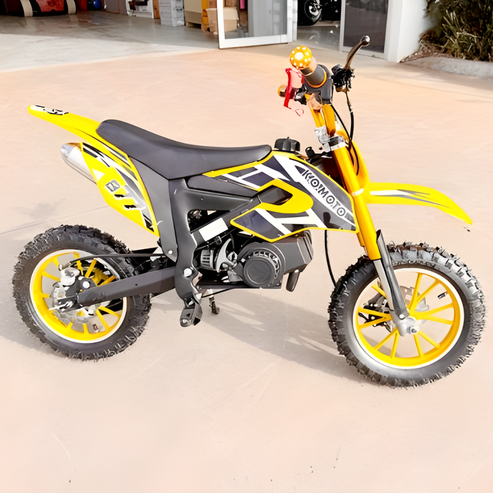 Yellow and black dirt bike on a concrete surface