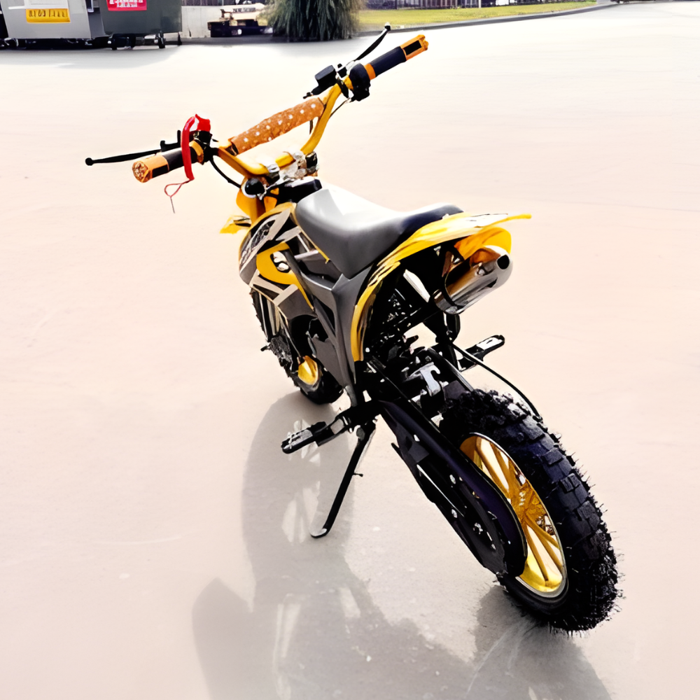 Yellow and black dirt bike on a concrete surface