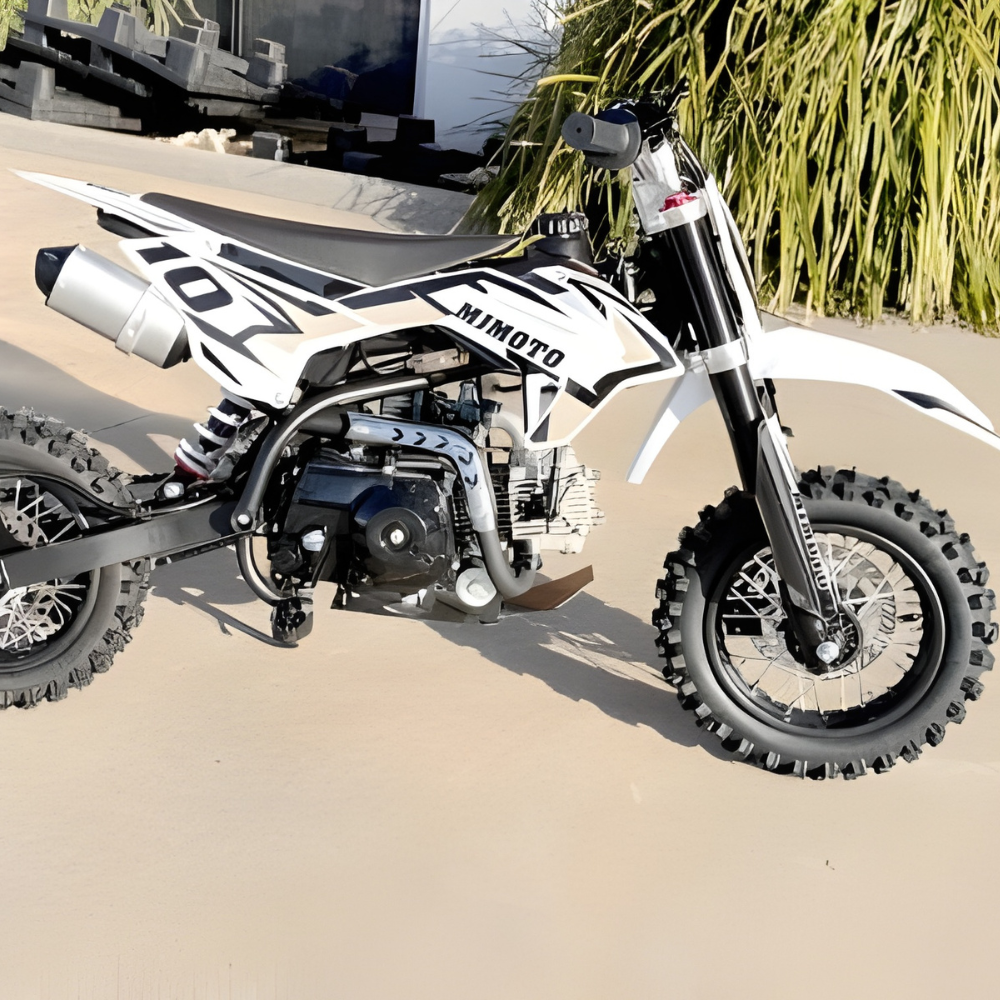 Motocross bike with 'Mimoto' branding on a sandy surface.