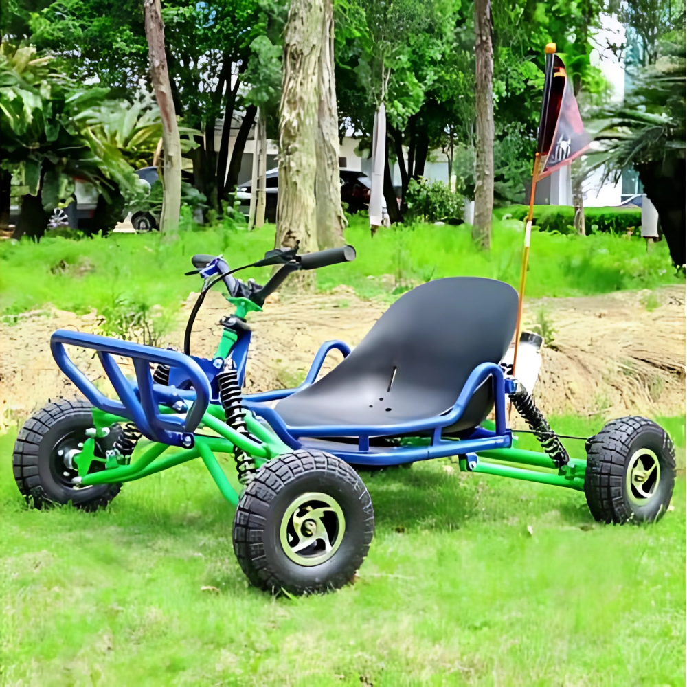Blue and green kids pedal go-kart parked on grass with trees in the background, outdoor lifestyle setting.