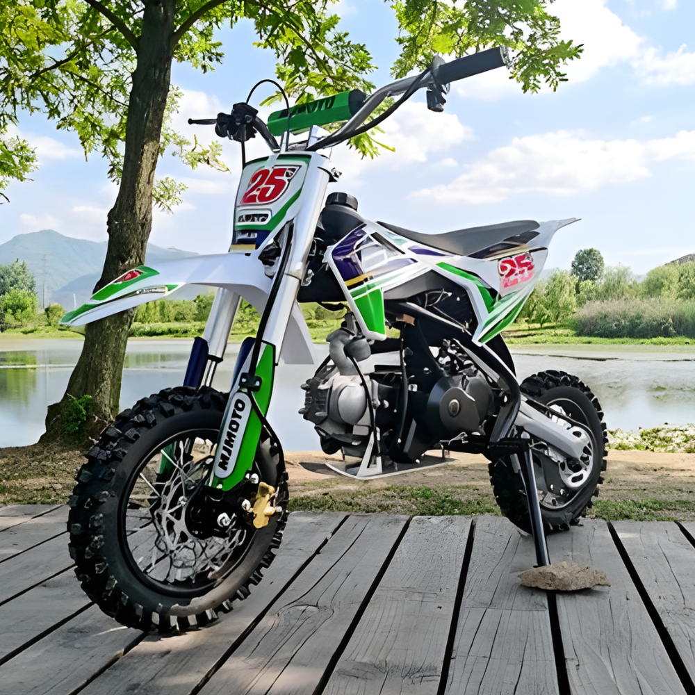 Children's dirt bike on a wooden platform with a scenic background