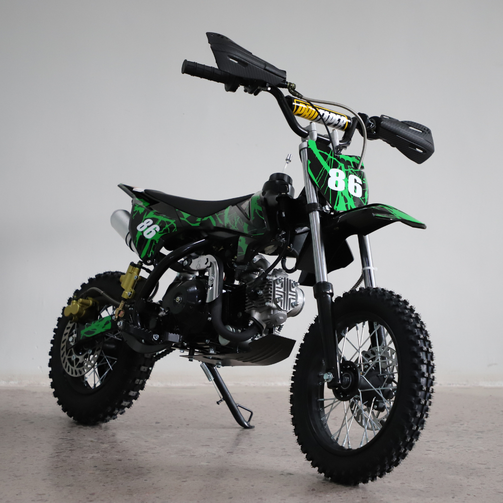 Left-side view of the dirt bike, showing kickstand down and full profile with visible engine and frame.