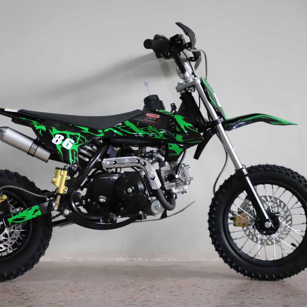Side view of the 50cc dirt bike facing right, showcasing full body graphics and handlebar detail against a white background.