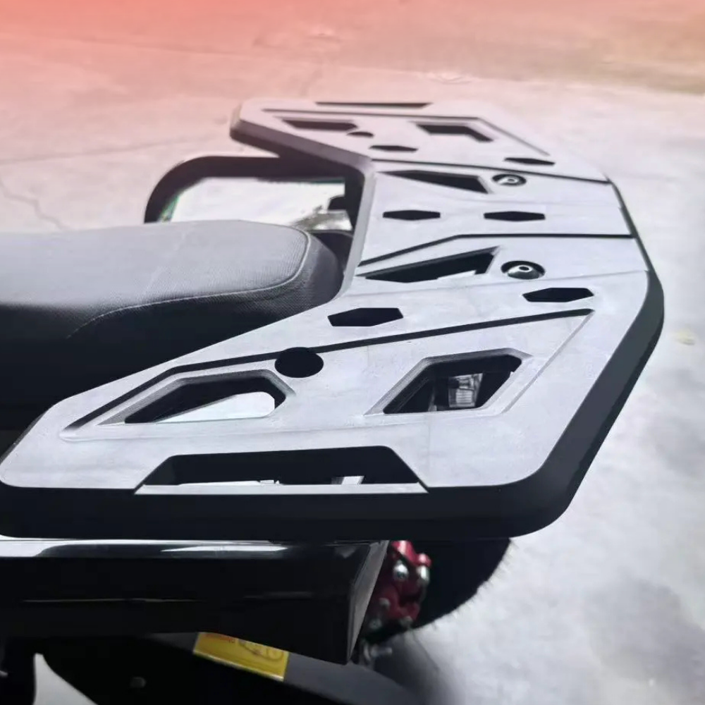 Close-up of a motorcycle license plate holder on a motorcycle with a blurred background.