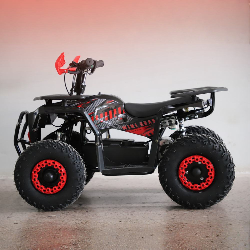 Black and red ATV on a gray surface with a gradient background