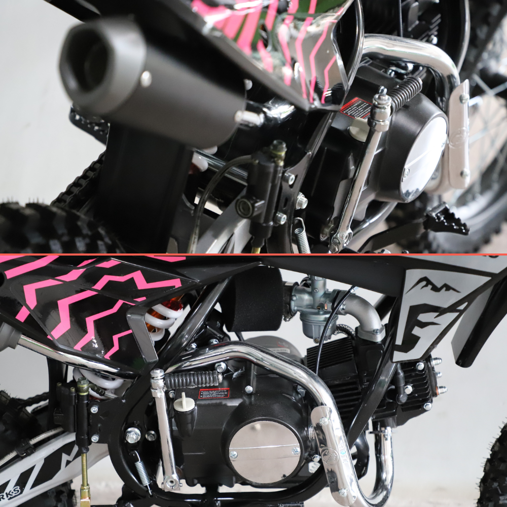 Close-up of a small off-road dirt bike or mini motorcycle showing the engine, exhaust, frame, and patterned body panels in black and bright pink.