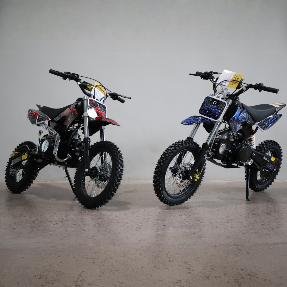 Two dirt bikes on a gray background