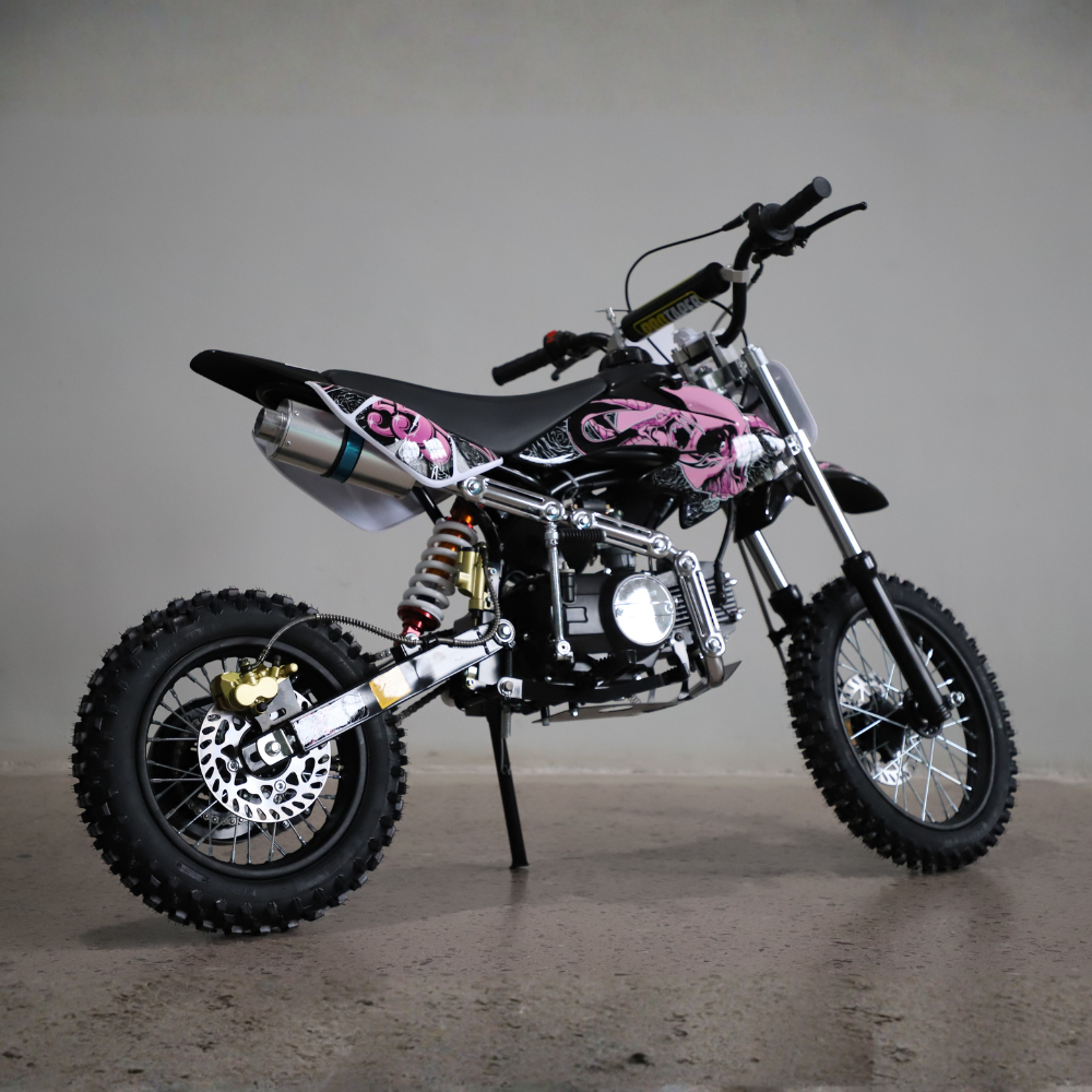 Small dirt bike with pink accents on a gray background