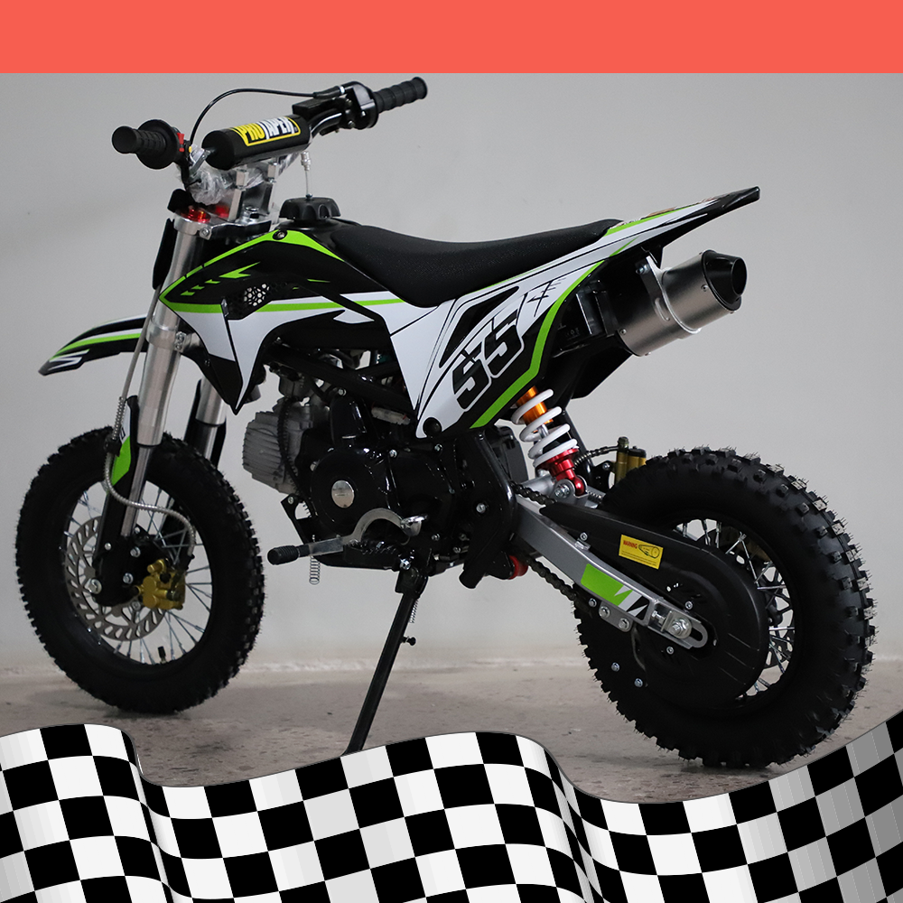 A left-side angled view of the dirt bike displaying the exhaust and rear wheel, with a checkered background.