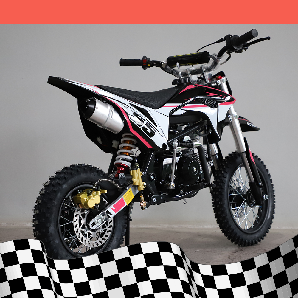 A right-side angled view of the dirt bike displaying the exhaust and rear wheel, with a checkered background.