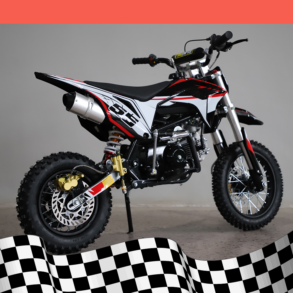 A back-right angled view of the dirt bike, showcasing the exhaust pipe and rear suspension, on a checkered background