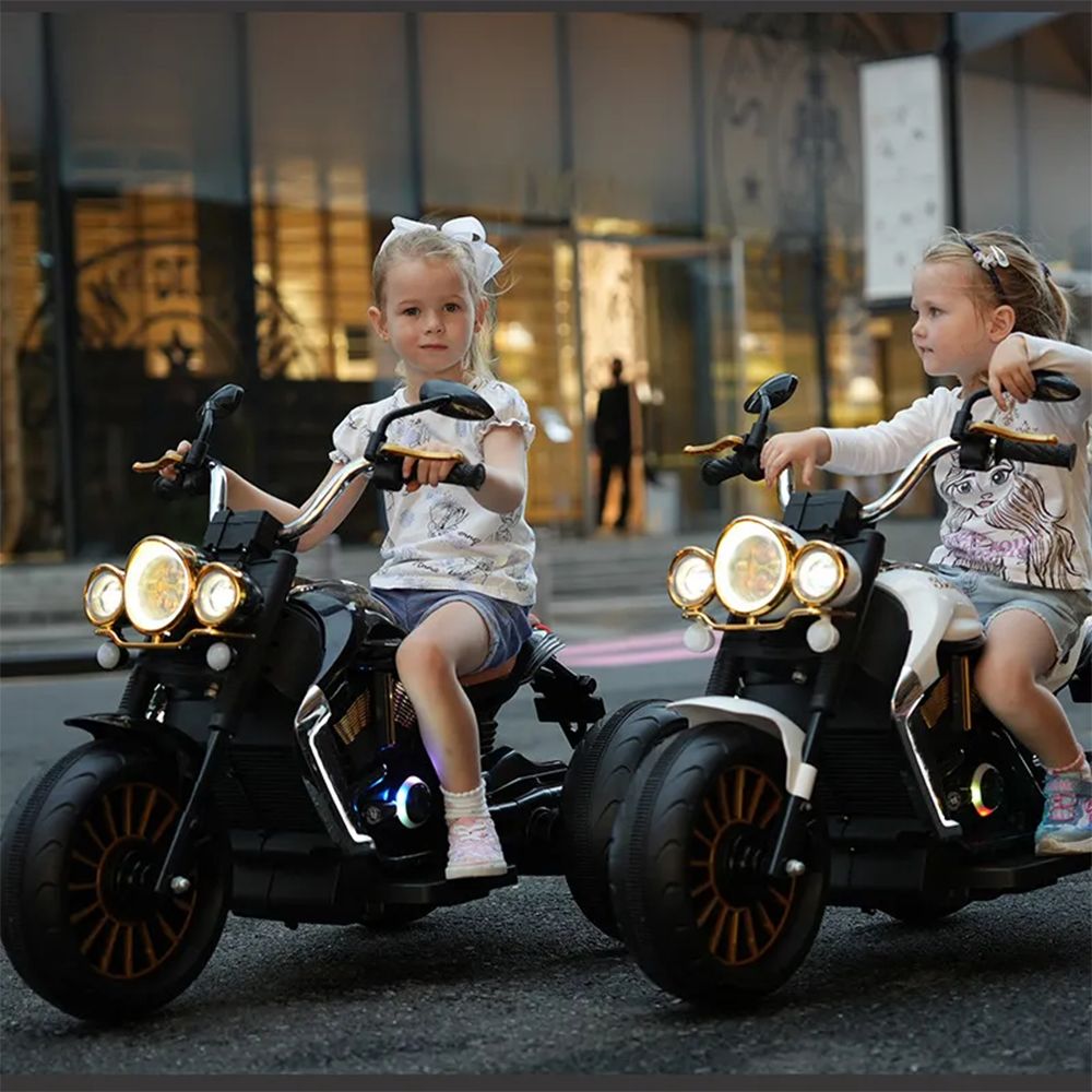 Lifestyle Image with Children: Two children riding the motorcycles (white and black versions) outdoors, showcasing its realistic and fun design in a playful, real-life setting.