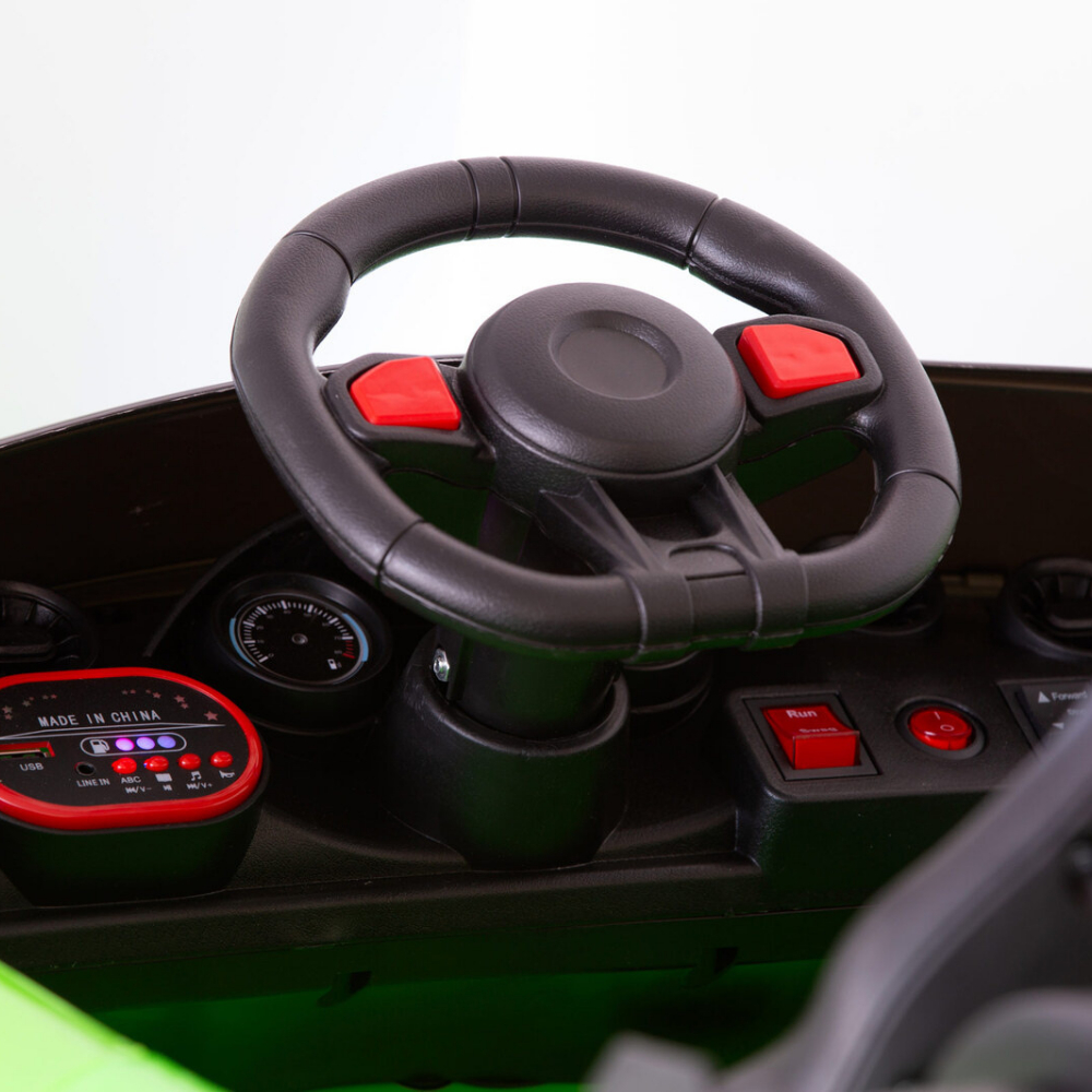Steering wheel and dashboard of a toy car with red buttons on a white background