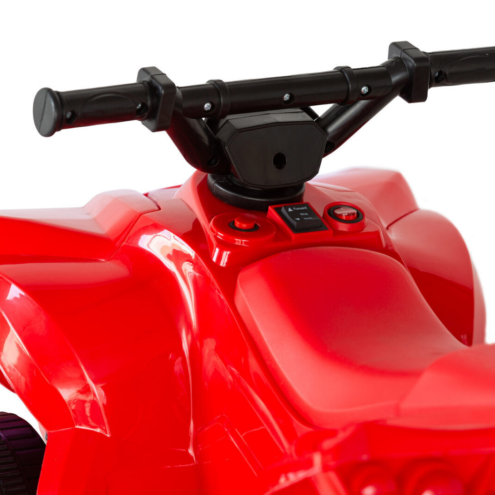 Close-up of a red ATV with black handlebars on a white background