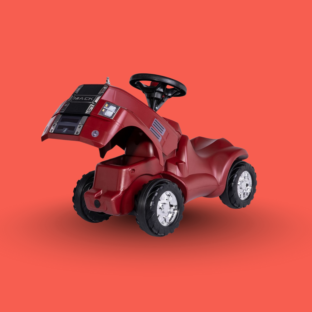 Red toy truck with black wheels on an orange background