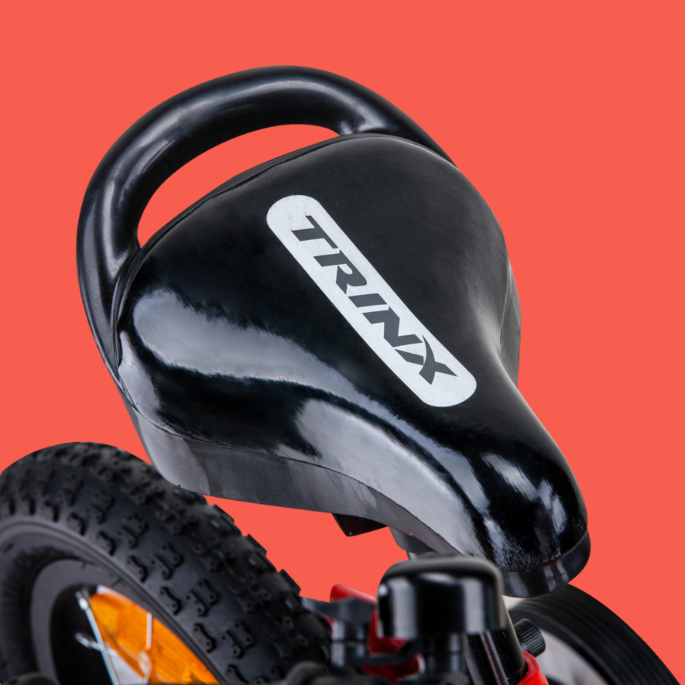 Black children's bike seat with 'TRINX' branding on a red background