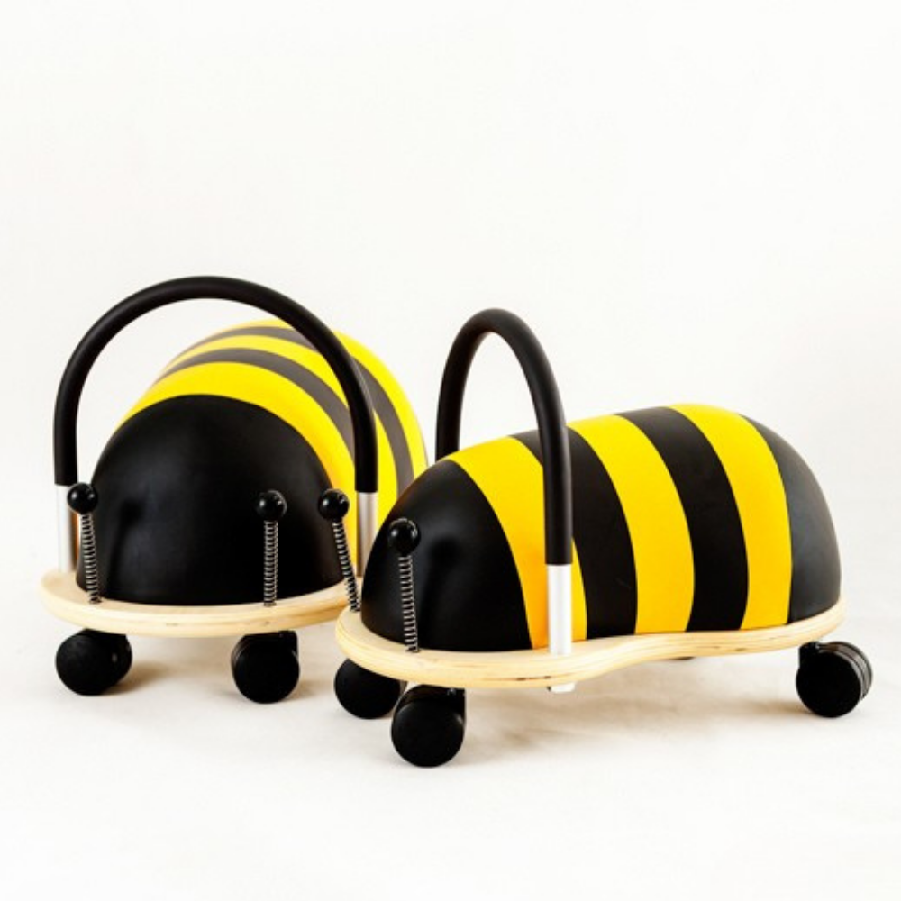 Two bumblebee-themed wheeled toys on a white background