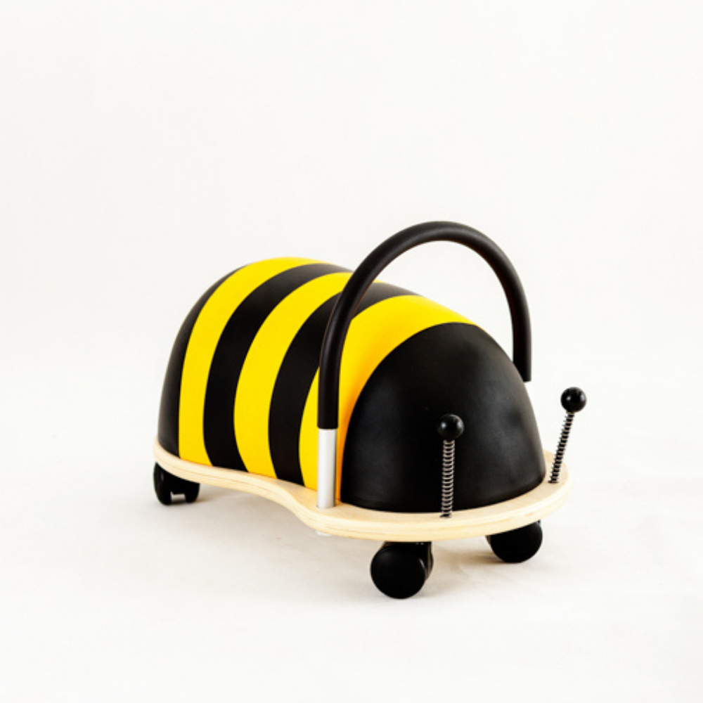 Toy vehicle shaped like a bee with black and yellow stripes on a white background