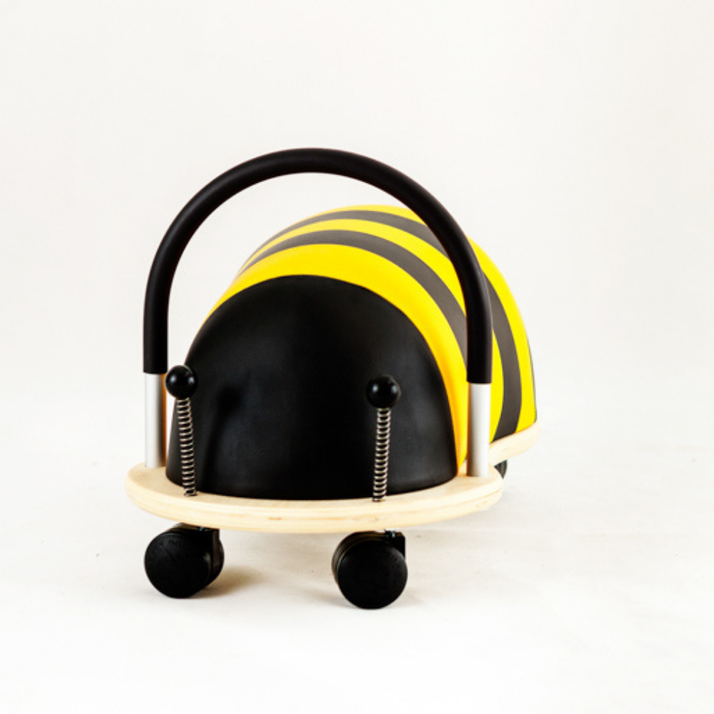 Toy vehicle shaped like a bee on a white background