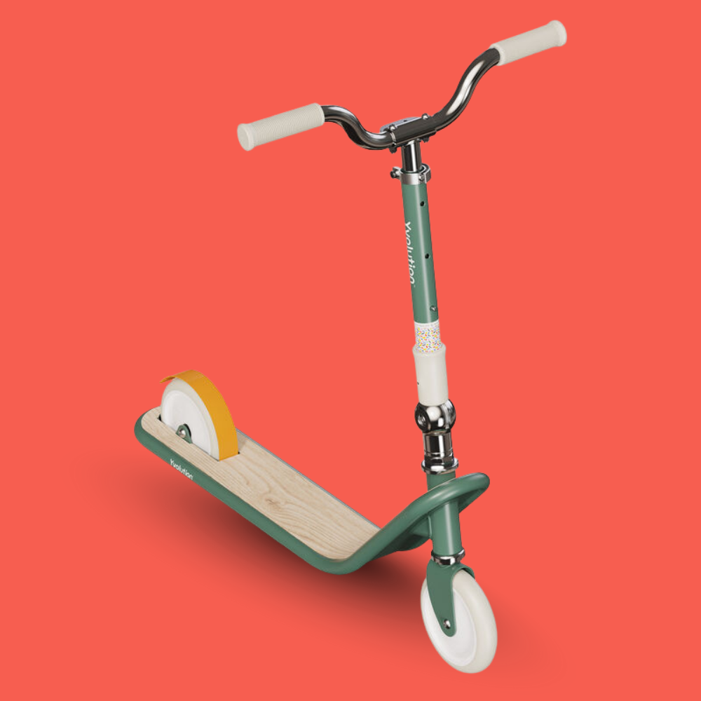 Green scooter with a wooden deck on a red background