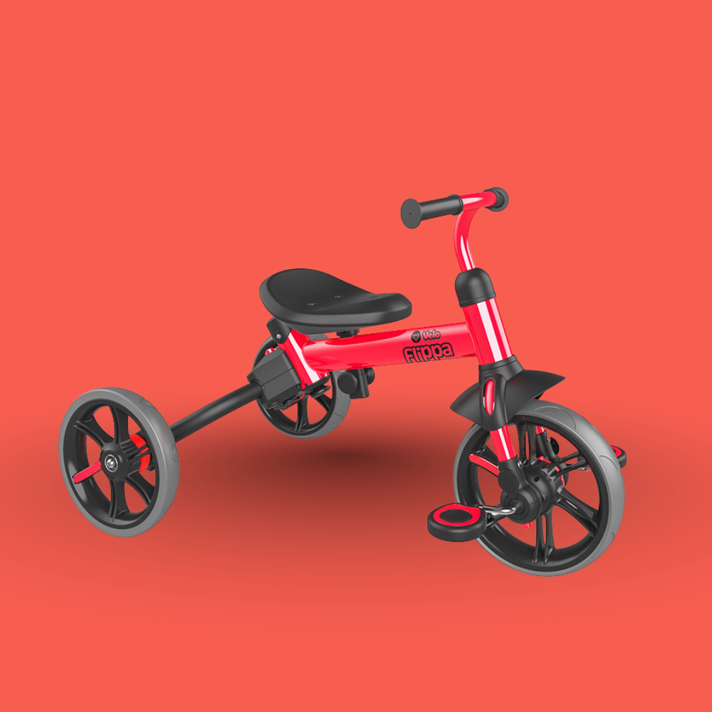 Red and black tricycle on a red background