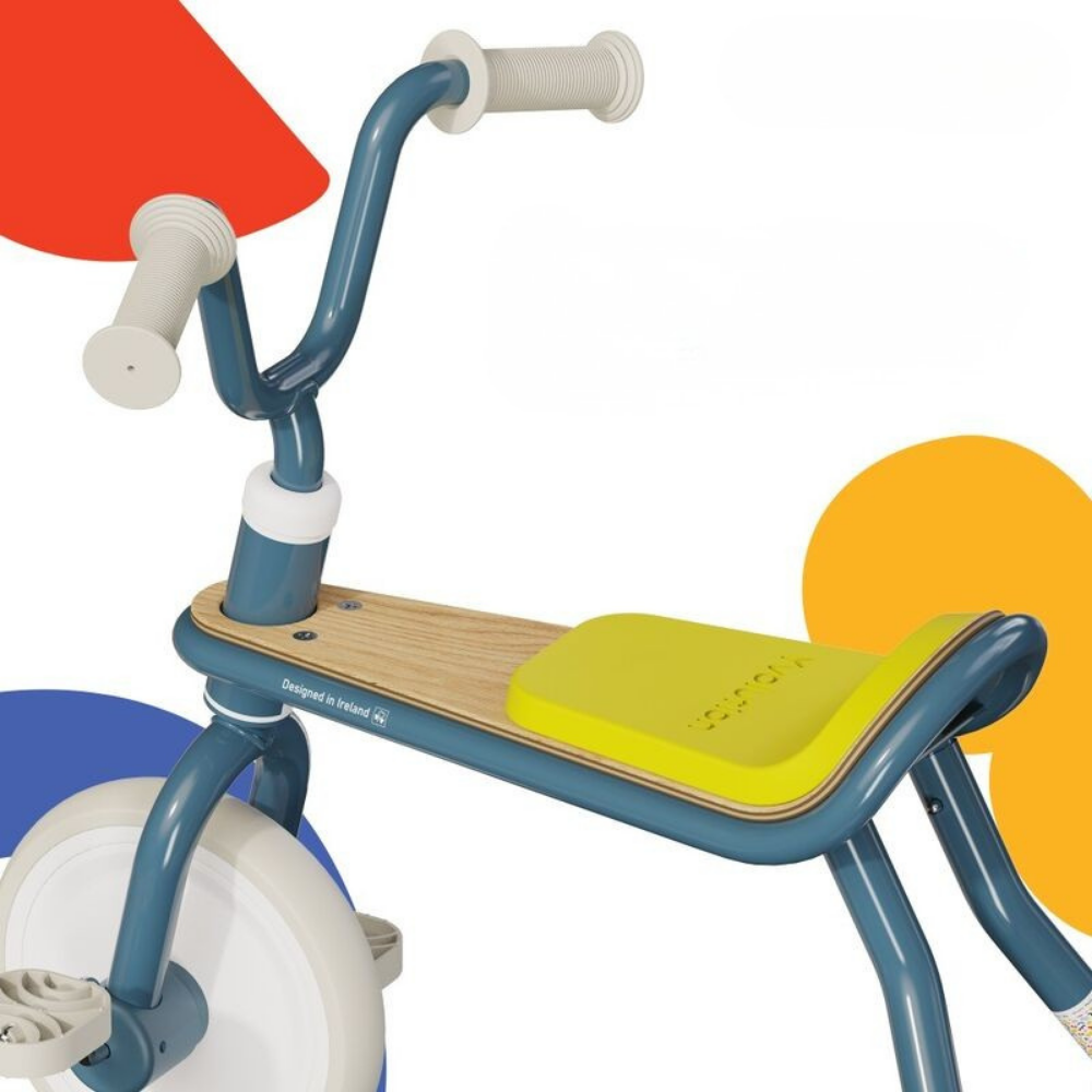 Colorful children's tricycle with a red seat, blue frame, and yellow seat pad on a white background.