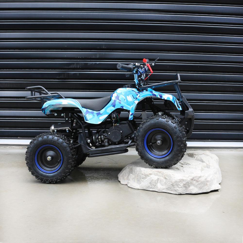 MJM 49cc Petrol Powered 2-Stroke Farm Kids ATV Quad Bike displayed on the white solid rough stone