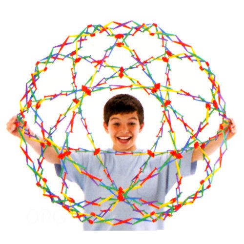 boy smiling and playing with rainbow ball