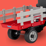 Red toy wagon with gray bed and visible branding on a red background